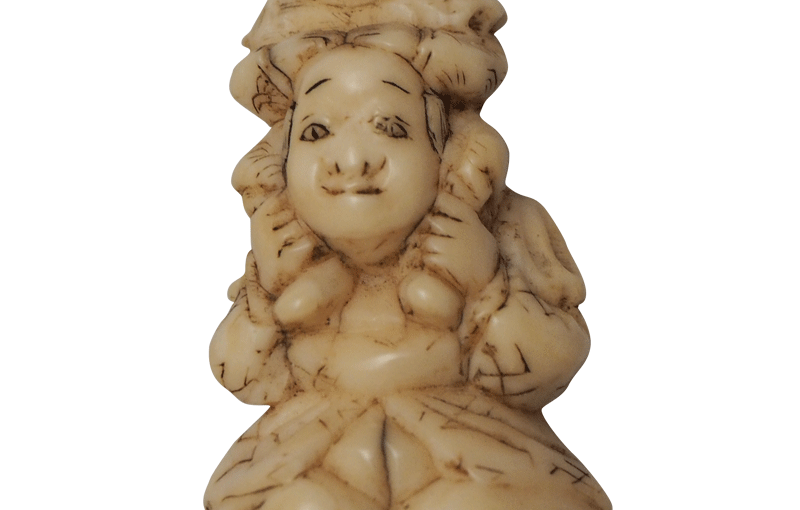 Netsuke button: a stich in time